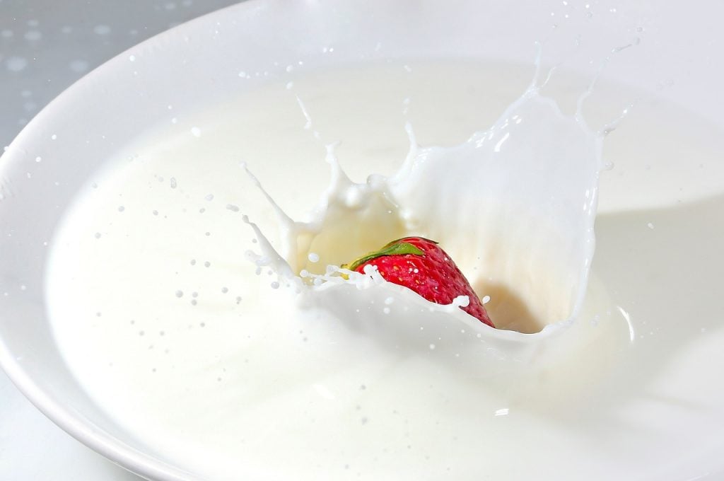 strawberry into milk